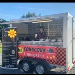 Moroccan food trailer serving homemade couscous in a French local market