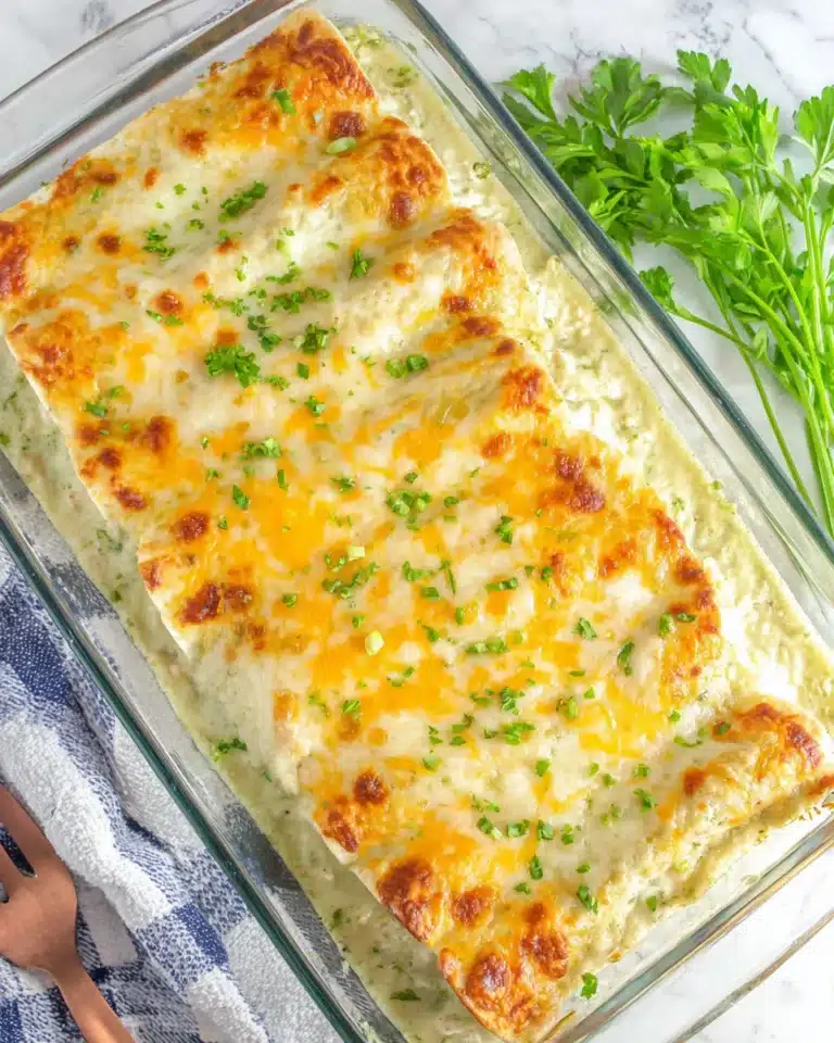 Baked creamy chicken enchiladas with golden melted cheese